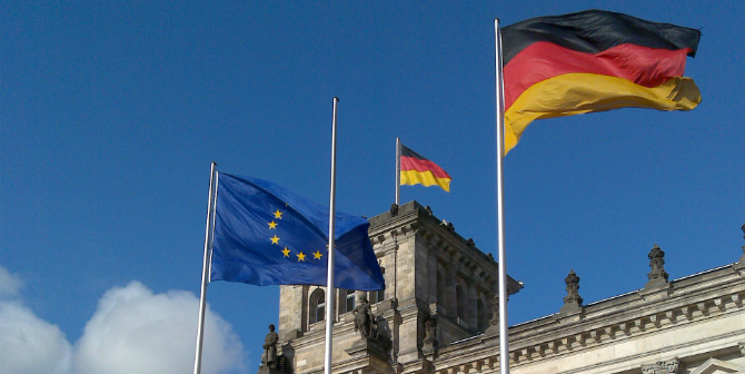 european_and_german_flags_in_front_of_reichstag