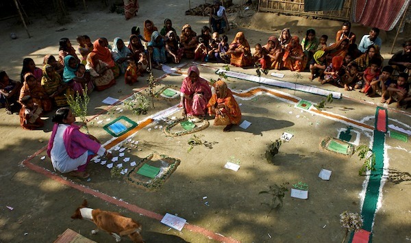 A group of men and women attend a Participatory Rural Appraisal (PRA) in Kaposhatia in Pakchanda union in Hossanipur upazila. Bangladesh. Women who are identified as an ultra poor by PRA receives a male and a female cow, a cow shed and three days long enterprise training on cow-raring from BRAC. She also receives Taka 175/week for 50 weeks.