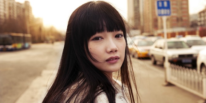 Young Chinese Woman. Photo Credit: Jonathan Kos-Read. CC-BY.
