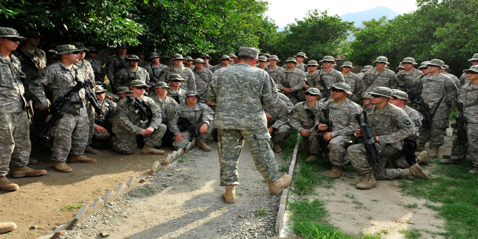 100805-F-7552L-211 Commander of the International Security Assistance Force Gen. David H. Petraeus (center), U.S. Army, talks with U.S. soldiers of the 2nd Battalion, 327th Infantry Regiment, 1st Brigade Combat Team, 101st Airborne Division at Combat Outpost Monti in eastern Afghanistan on Aug. 5, 2010. DoD photo by Staff Sgt. Bradley Lail, U.S. Air Force. (Released)