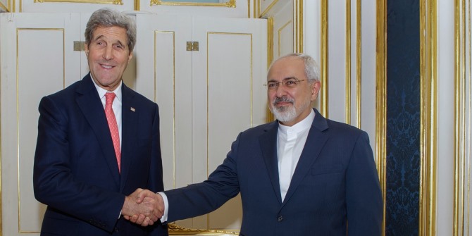 U.S. Secretary of State John Kerry shakes hands with Foreign Minister Javad Zarif of Iran in Vienna, Austria,  2014. Source: flickr.com