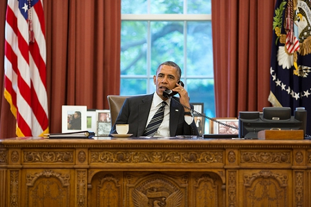 President Barack Obama talks with President Hassan Rouhani of Iran during a phone call in the Oval Office, Sept. 27, 2013. (Official White House Photo by Pete Souza) 