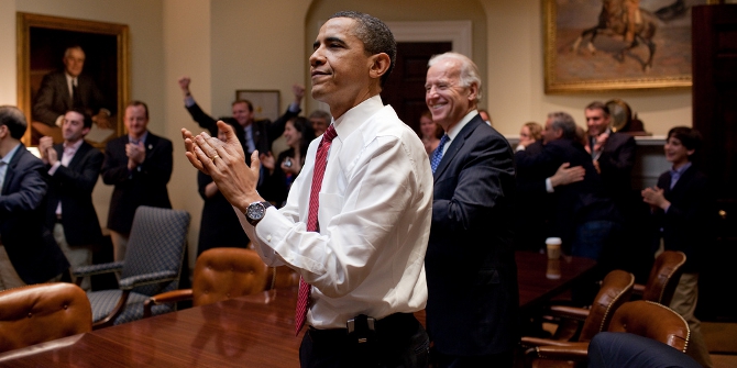 President Barack Obama, Vice President Joe Biden, and senior staff, react in the Roosevelt Room of the White House, as the House passes the health care reform bill, March 21, 2010. (Official White House Photo by Pete Souza)