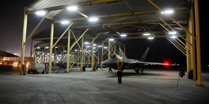 An F-22A Raptor waits to taxi in the U.S. Central Command area of responsibility prior to strike operations in Syria Sept. 23, 2014. These aircraft were part of a large coalition strike package that was the first to strike ISIL targets in Syria. (U.S. Air Force photo by Tech. Sgt. Russ Scalf)