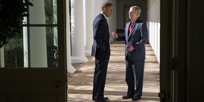 President Barack Obama talks with Senate Minority Leader Mitch McConnell, R-Ky., on the Colonnade of the White House, Nov. 7, 2014. (Official White House Photo by Pete Souza)